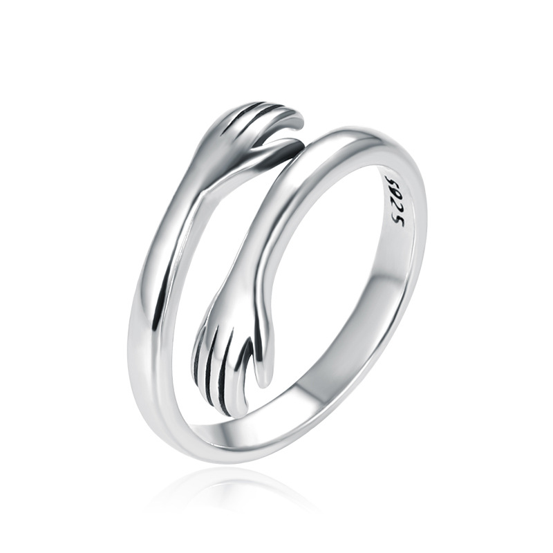 925 Sterling Silver and Gold Hug Ring | Hug ring featuring embracing hands—a gift for her, girlfriend, boyfriend, Mother's Day, or engagement. 1 925 Sterling Silver and Gold Hug Ring | Hug ring featuring embracing hands—a gift for her, girlfriend, boyfriend, Mother's Day, or engagement.